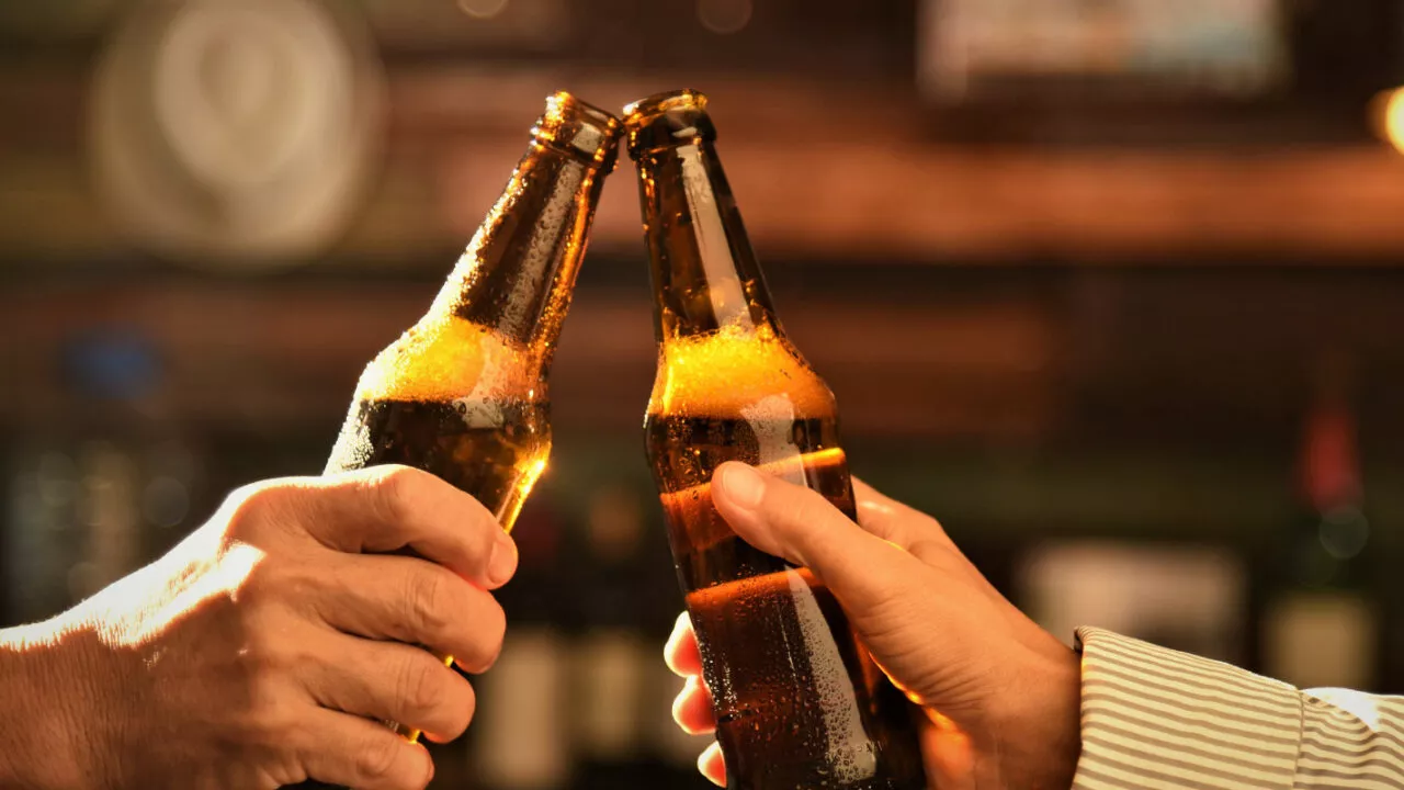 Why does beer taste better in glass?