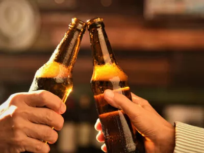 Why does beer taste better in glass?
